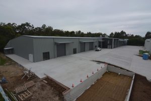 large grey steel manufacturing shed